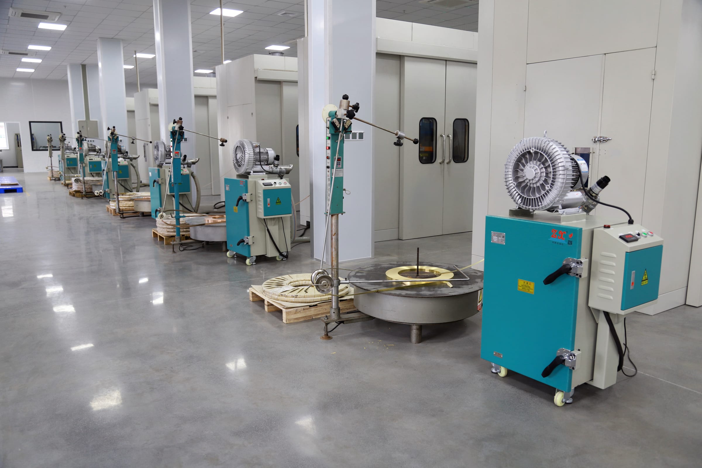 Konnra stamping workshop: terminal stamping equipment on a polished floor